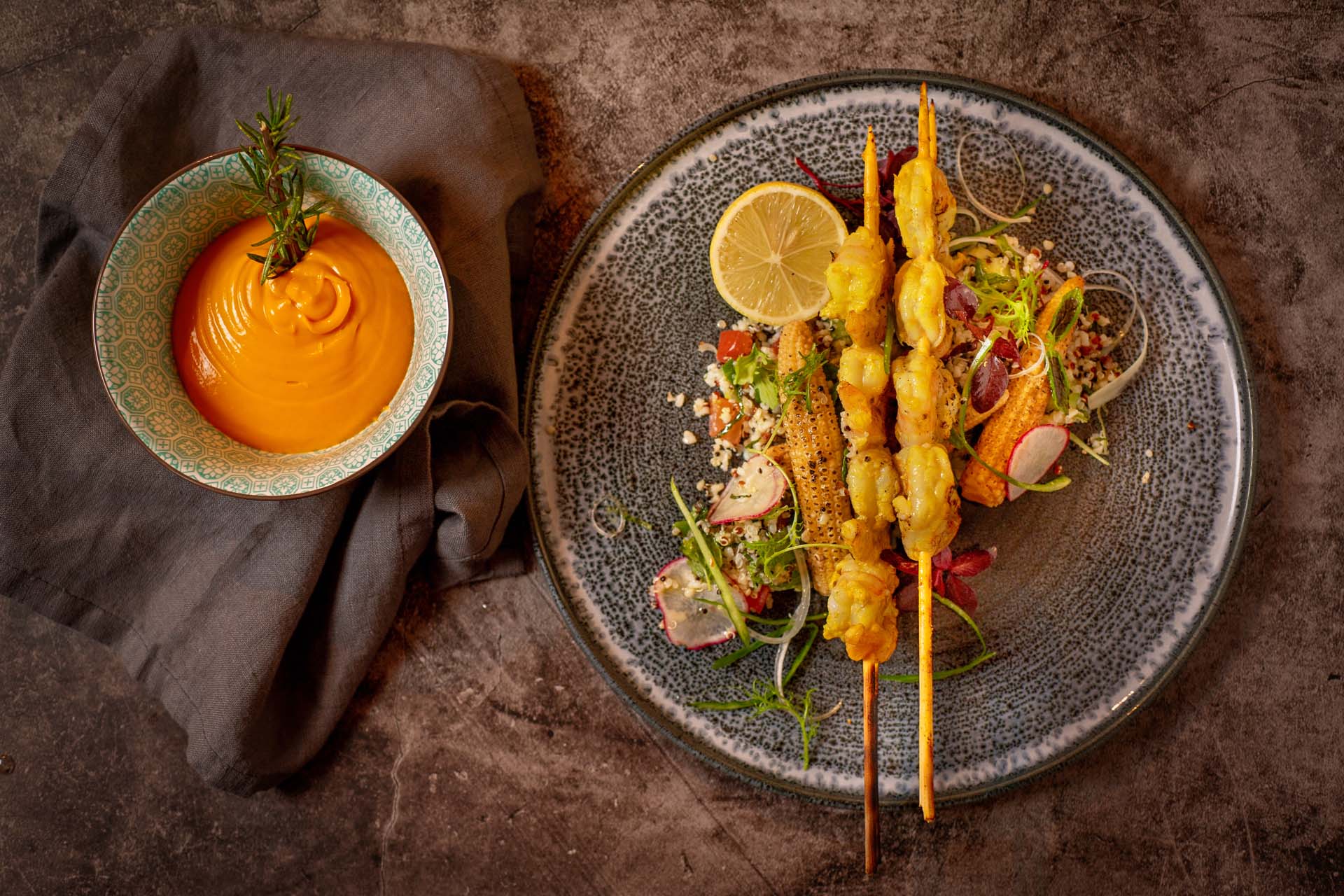 Shrimp satay marinated in coconut milk with curry, quinoa salad and grilled corn on the cob - 7 Thal